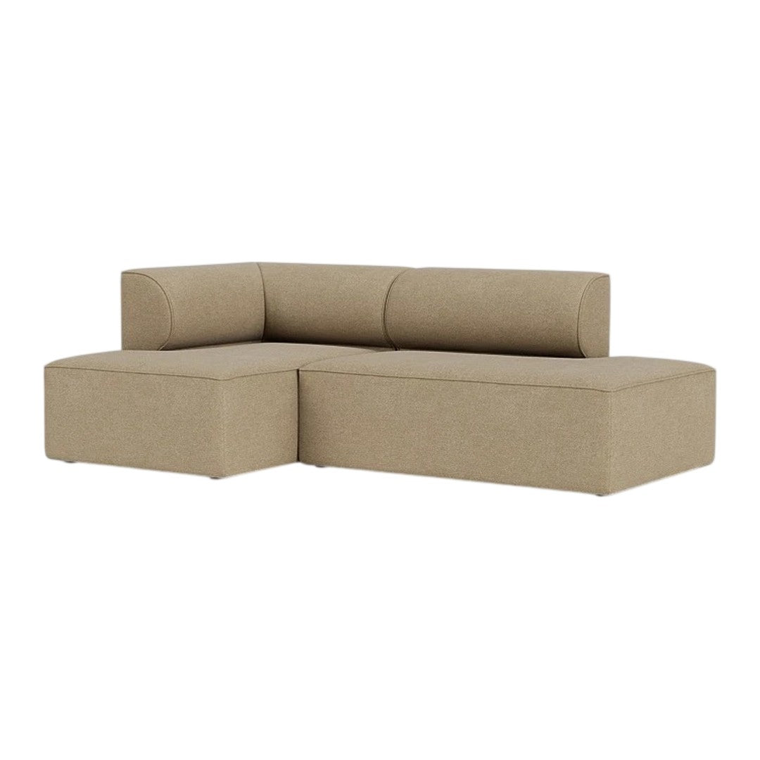 Beige fabric sectional sofa with a smooth texture and minimalist design, perfect for modern living spaces.