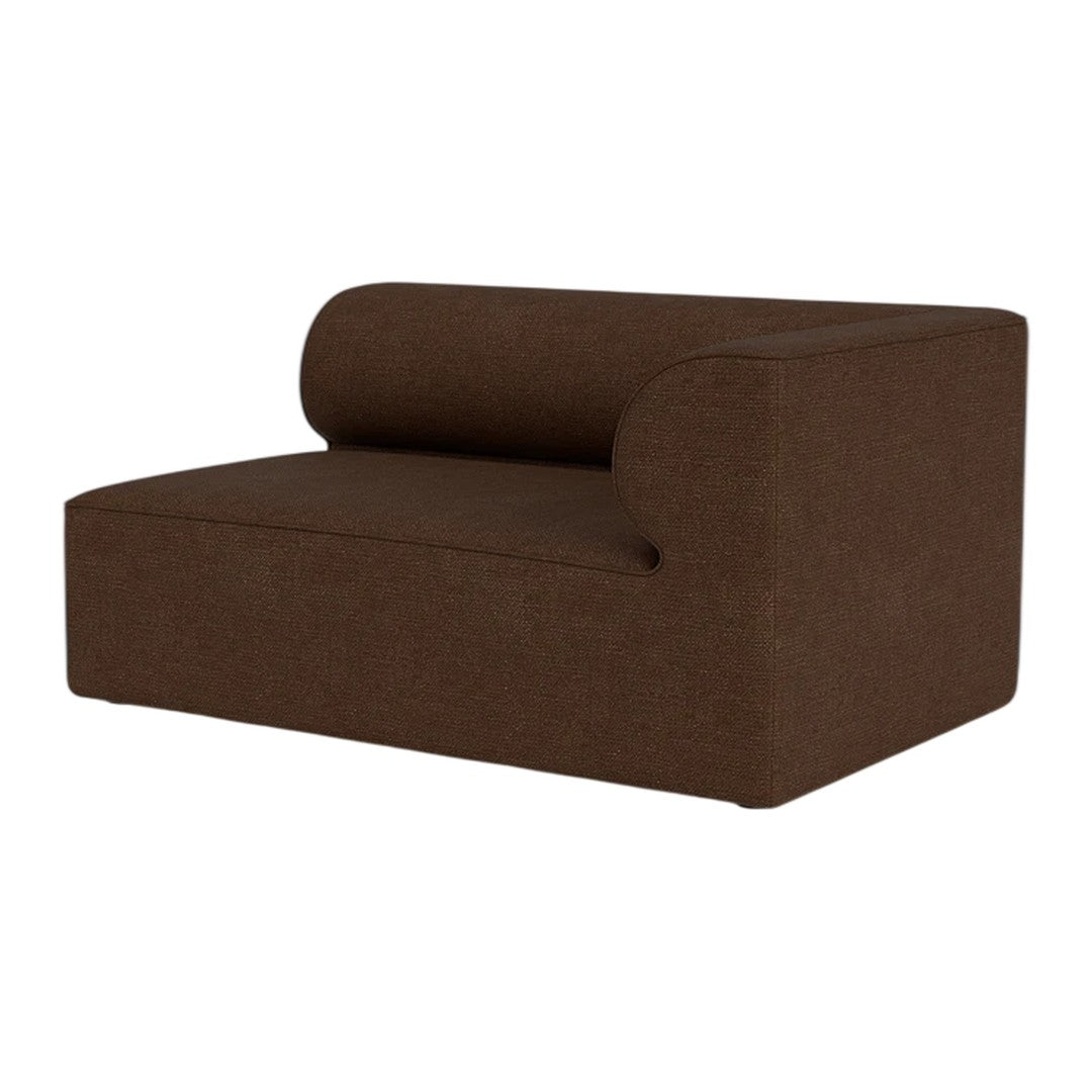 Brown upholstered chair with a curved back and minimalist design, showcasing a solid textured fabric.
