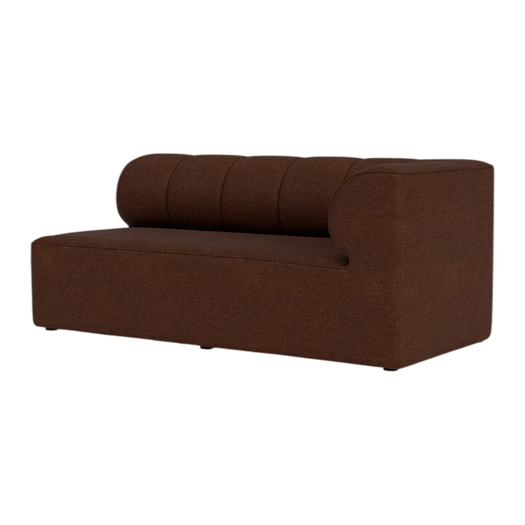 Brown upholstered sofa with a smooth texture and tufted backrest design.