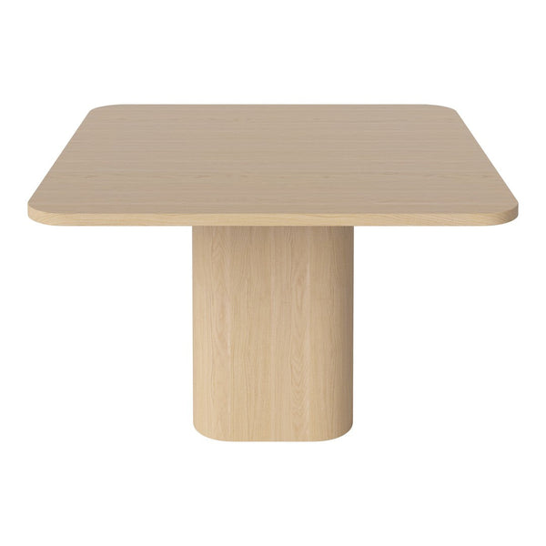 Light beige square table with a smooth, matte finish and a cylindrical pedestal base. Simple, modern design.