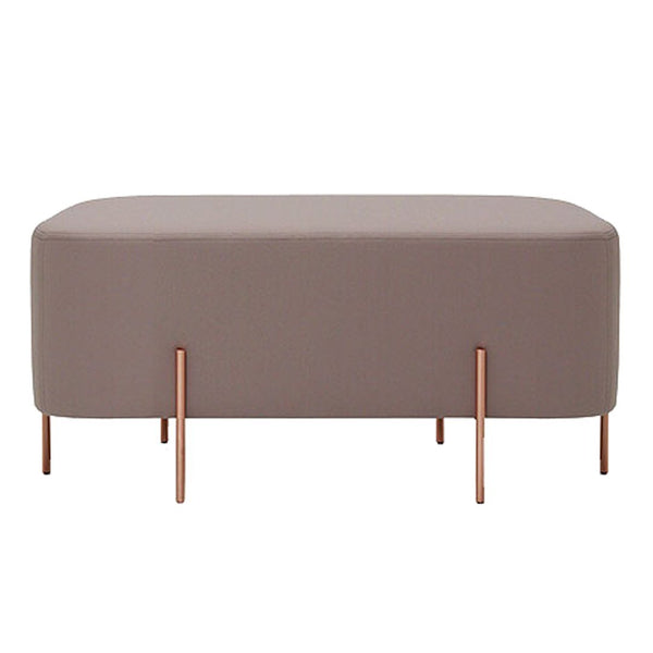 "Soft taupe ottoman with sleek copper legs, featuring a modern and minimalist design."