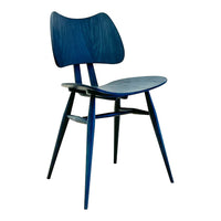 Blue wooden chair with a sleek, modern design and subtle grain patterns. Elegant and minimalist style.