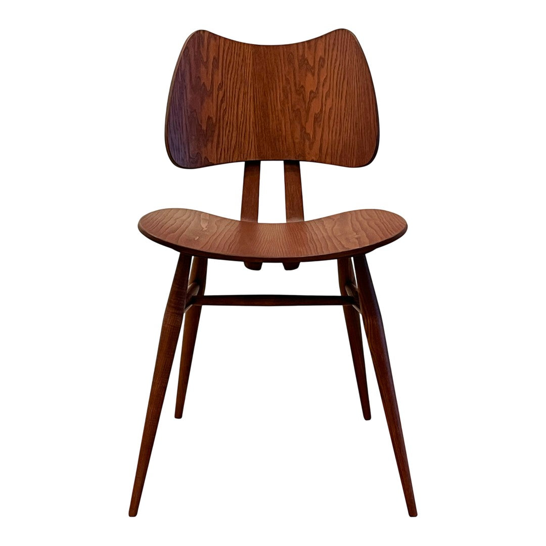 Mid-century wooden chair with a rich walnut finish and smooth, curved lines. Modern aesthetic with minimalistic design.