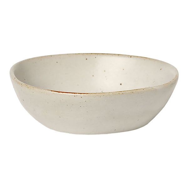 Smooth, oval-shaped ceramic bowl in a soft cream color with subtle speckles and a natural finish. Perfect for decor or serving.