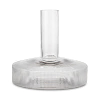 "Clear glass vase with a ribbed base and smooth top, showcasing transparent layers and elegant patterns."