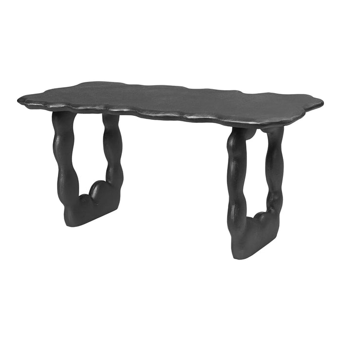 Black sculptural table with wavy edges and curved legs, showcasing a modern, minimalist design.