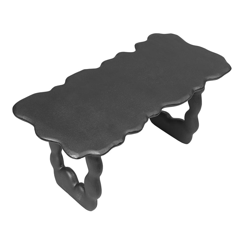 Black sculptural table with a wavy top and round, twisted legs, featuring a modern, artistic design.