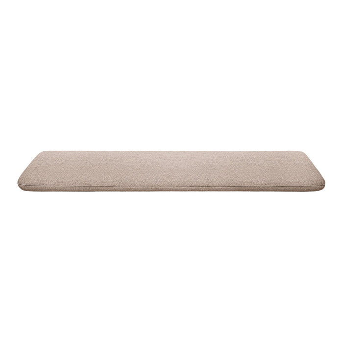 Beige rectangular cushion with a soft, textured surface and subtle pattern, ideal for home decor.