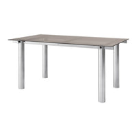 Modern rectangular dining table with a sleek gray glass top and silver metal legs. Simple, clean design.
