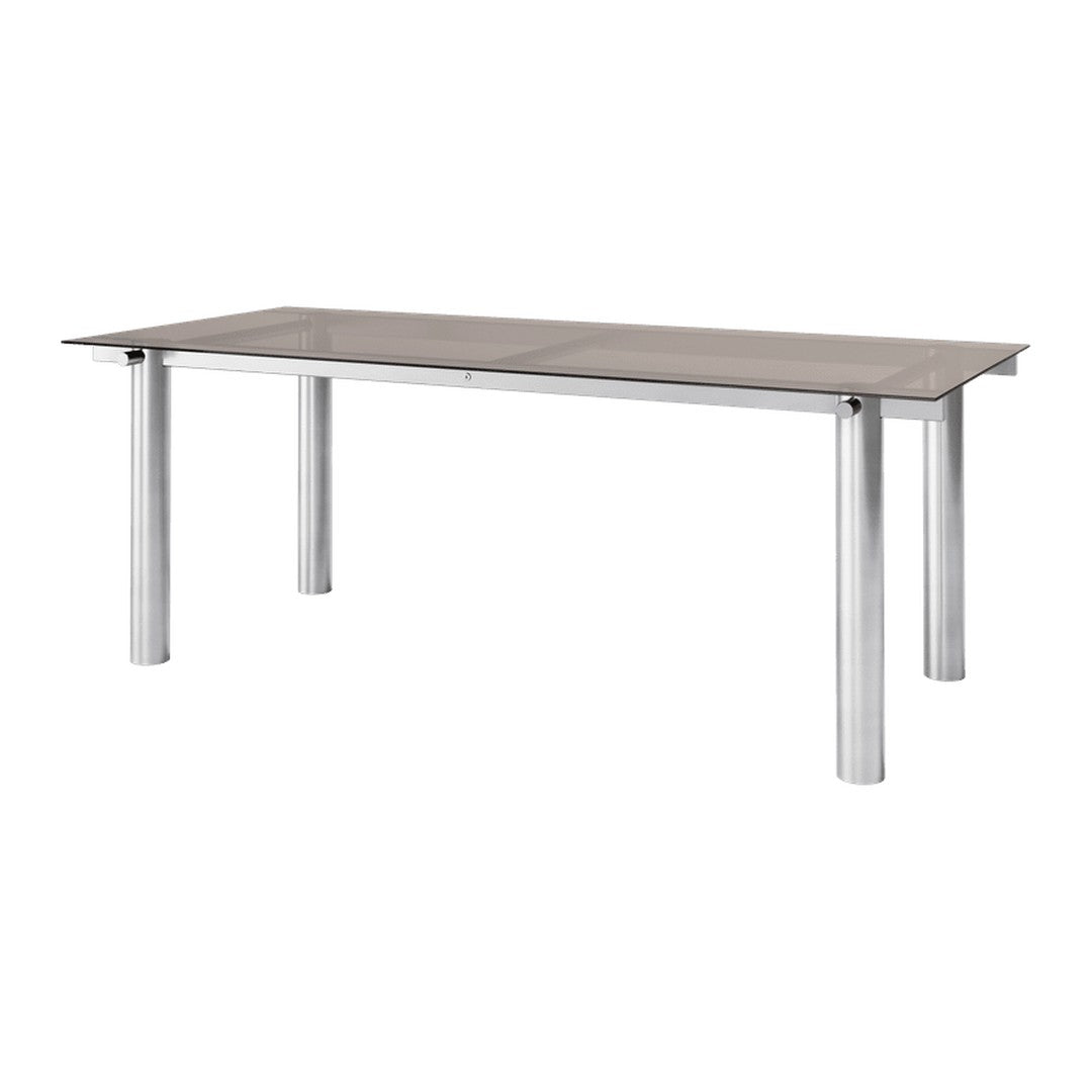 Rectangular dining table with a sleek silver metal frame and a smooth, gray tabletop. Modern and minimalist design.