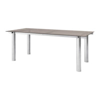 Rectangular dining table with a sleek silver metal frame and a smooth, gray tabletop. Modern and minimalist design.
