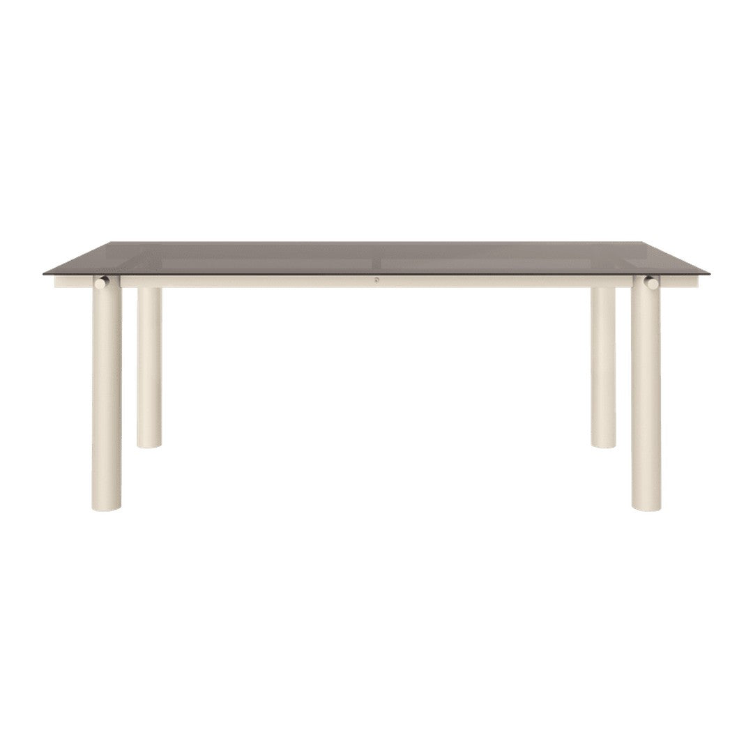 Rectangular dining table with a dark gray top and cream-colored legs. Sleek and modern design.