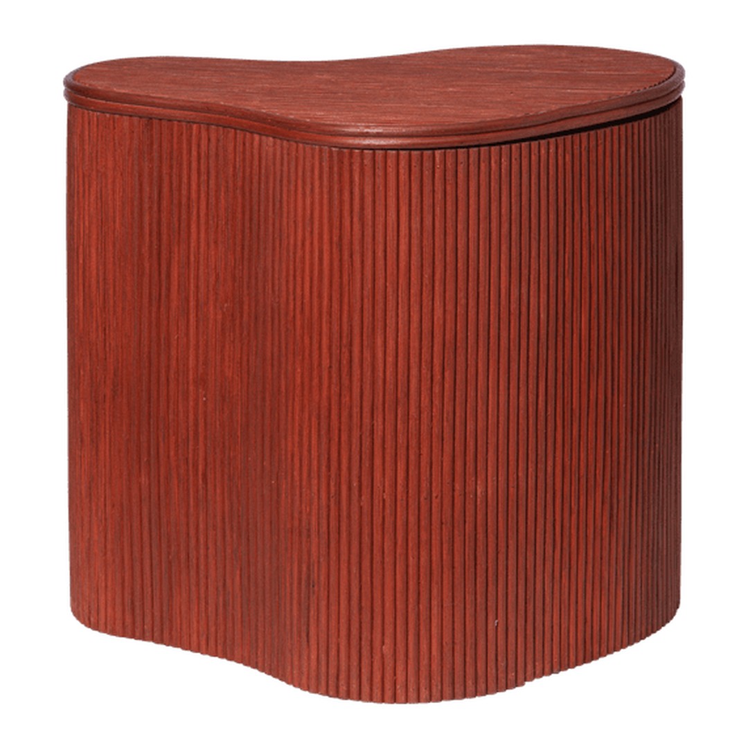 "Rich mahogany red accent table with ribbed texture and unique curved silhouette."