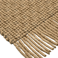 Braided jute rug in natural brown with textured pattern and fringed edges, perfect for rustic decor.