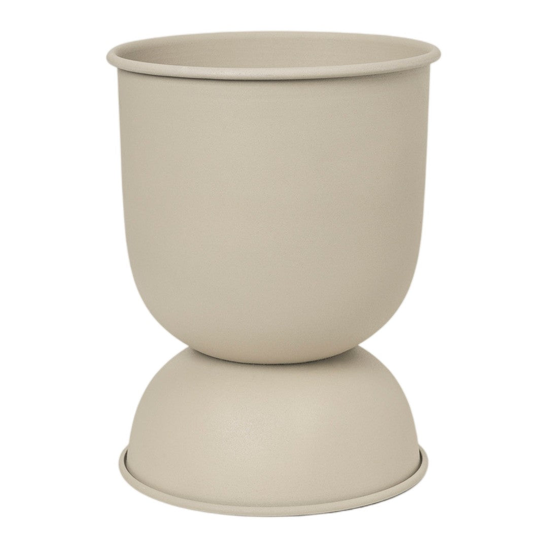 Beige ceramic planter with a smooth, matte finish and rounded silhouette. Ideal for modern decor.
