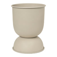 Beige ceramic planter with a smooth, matte finish and rounded silhouette. Ideal for modern decor.