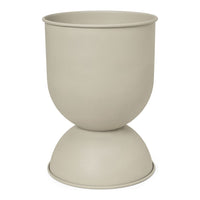 Beige ceramic planter with a smooth, matte finish and a modern hourglass shape. Ideal for any decor style.