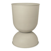 Sleek, modern planter in soft beige with a smooth matte finish, featuring a round base and bulbous design.