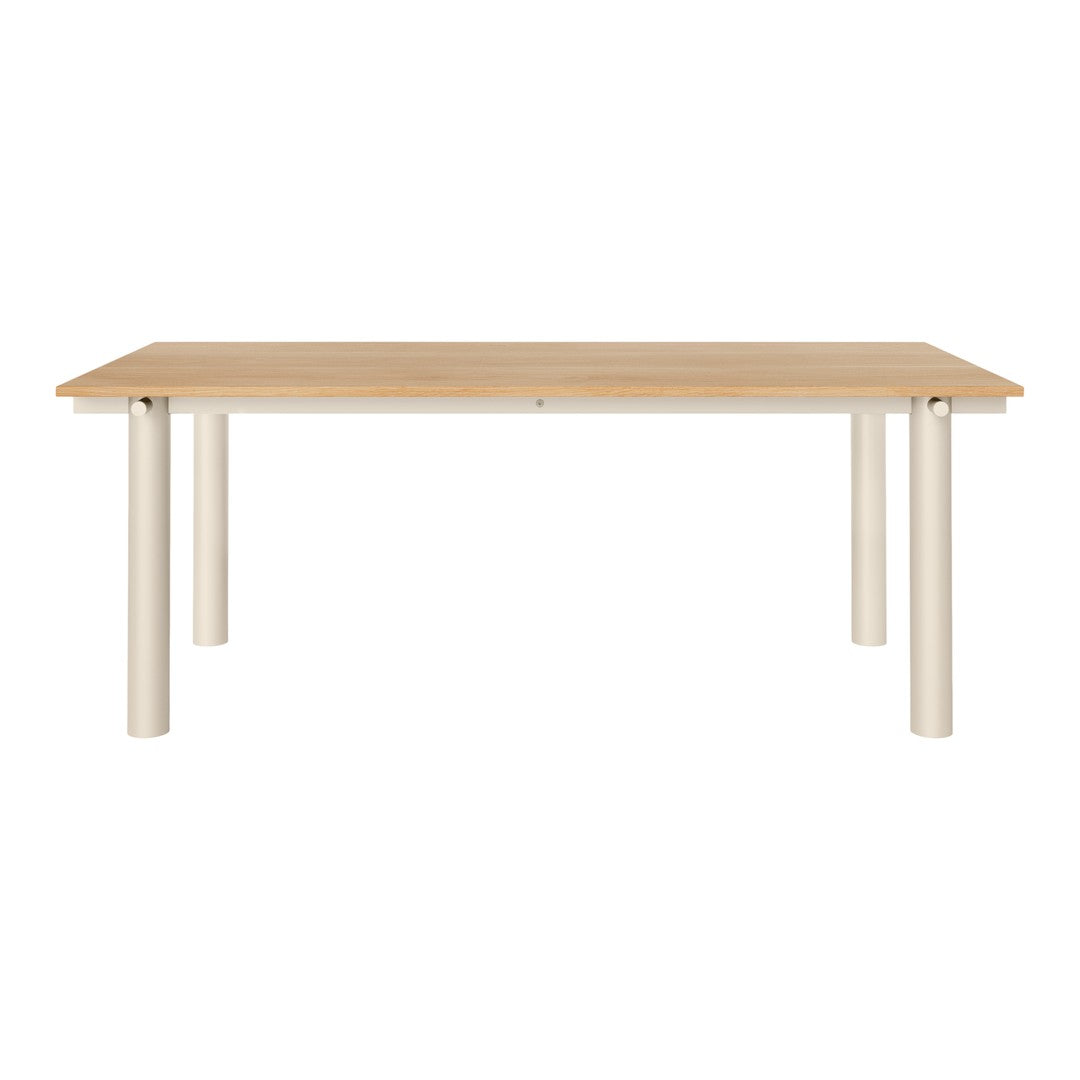 Modern rectangular dining table with a light wood finish and sleek white legs, showcasing a minimalist design.