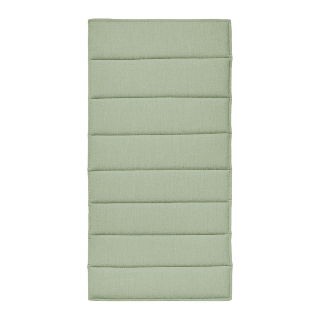 Light green padded mat featuring horizontal stitched patterns for added comfort and style.