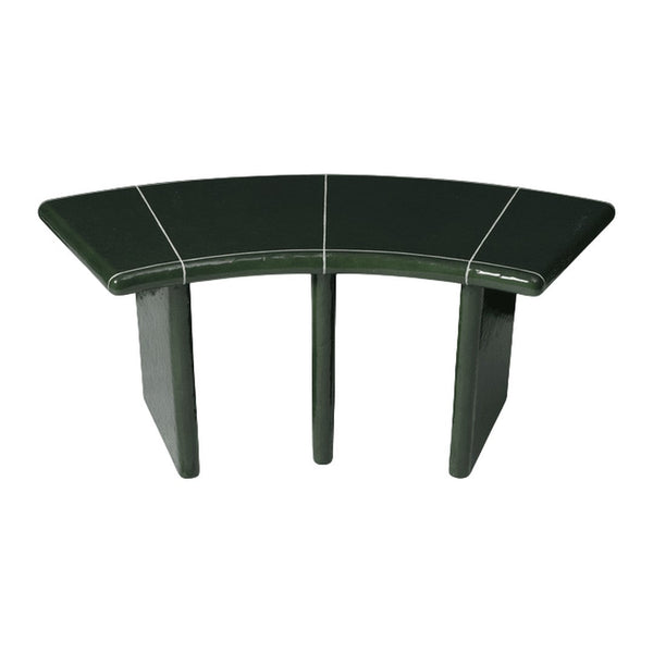 Curved green table with sleek black accents and a glossy finish, perfect for modern decor.