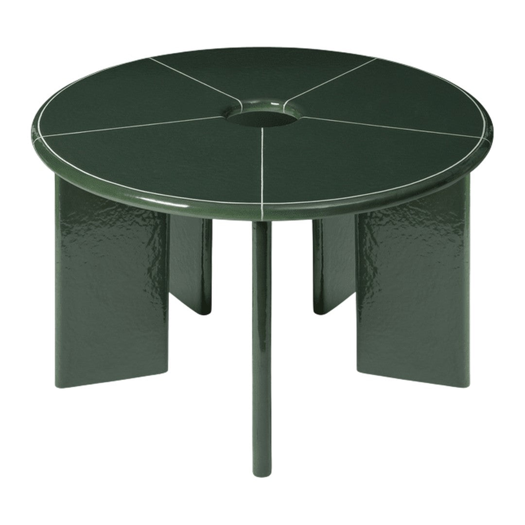 Round, dark green table with a smooth finish and geometric, segmented pattern on the surface.