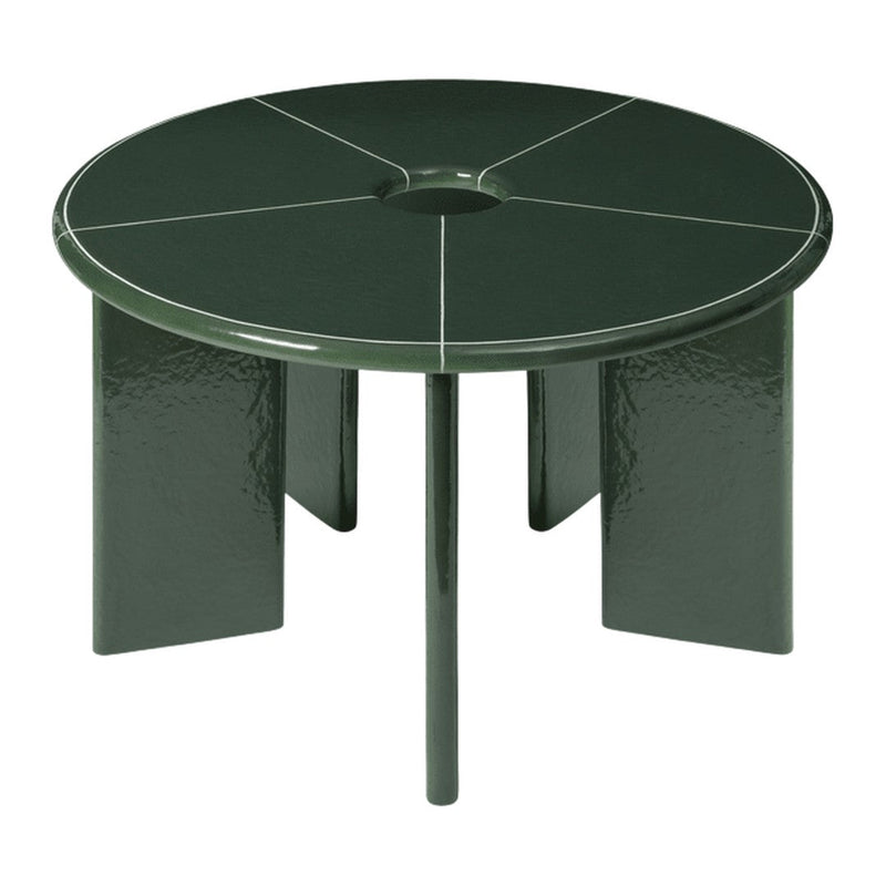 Round, dark green table with a smooth finish and geometric, segmented pattern on the surface.