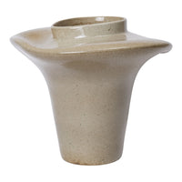 Beige ceramic vase with a smooth, glossy finish and a unique sculptural shape.
