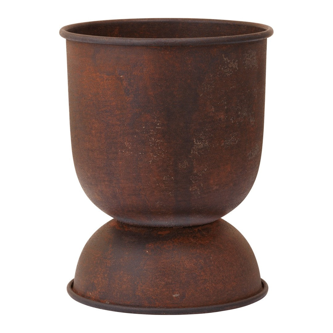 Rustic brown planter with a textured finish and a rounded base. Ideal for adding a vintage touch to your decor.