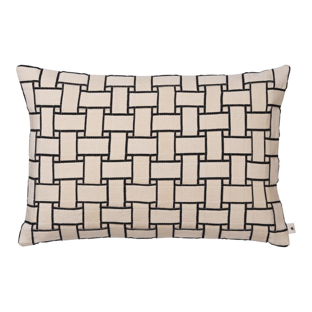 Tan and black woven pattern decorative pillow with a textured design.