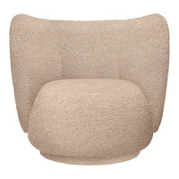 Soft beige chair with a textured, fluffy pattern, featuring a rounded shape and cozy, inviting design.
