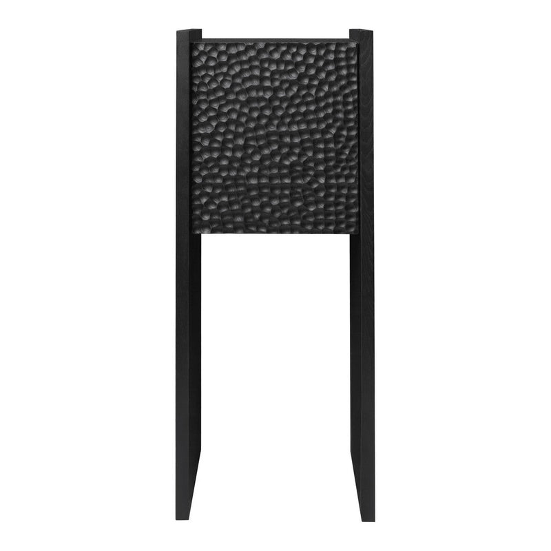 Black textured panel with a hammered pattern on a sleek black stand. Modern aesthetic for contemporary decor.