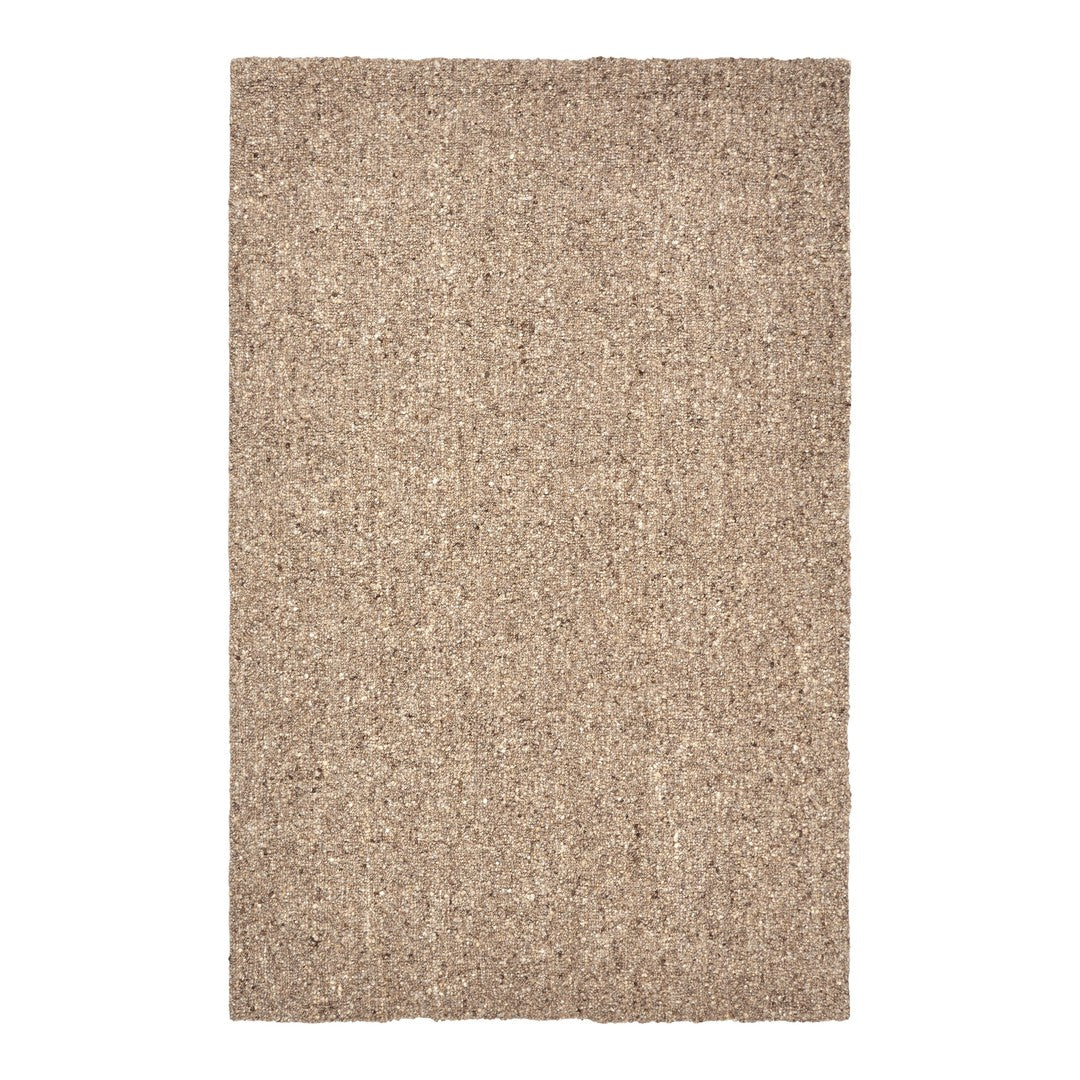 Beige textured rug with a natural, woven pattern perfect for a warm, inviting space.