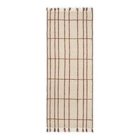 Beige rug with a brown grid pattern and fringed edges, perfect for adding a modern touch to any space.