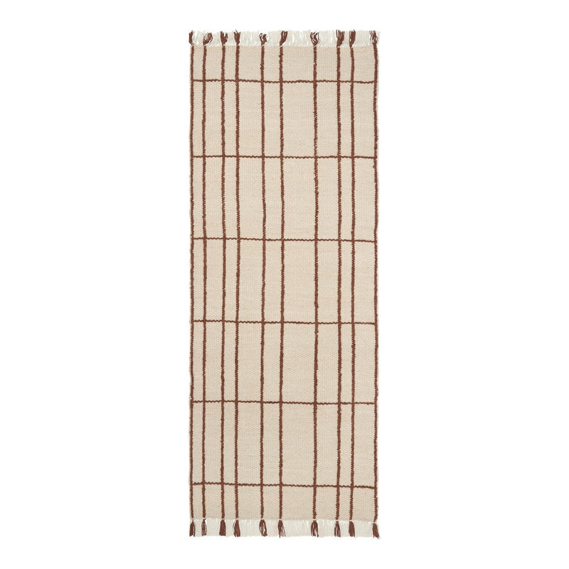 Beige rug with a brown grid pattern and fringed edges, perfect for adding a modern touch to any space.
