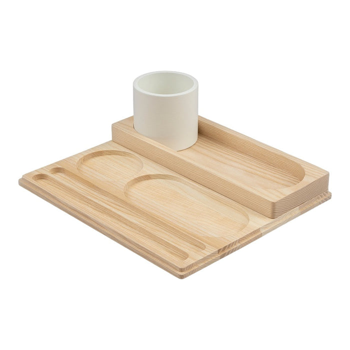 Light wood tray with smooth, minimalist design; white ceramic cup in a sleek, modern arrangement.