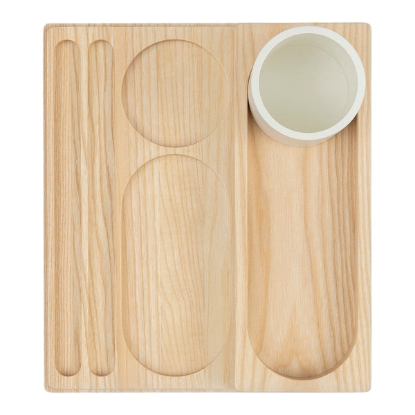 Natural wood grain tray with circular and oval cutouts, featuring a white cup and matching chopsticks.