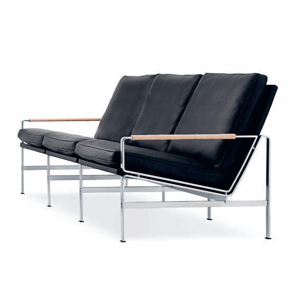 Black leather sofa with sleek chrome frame and wooden armrests, featuring a minimalist modern design.