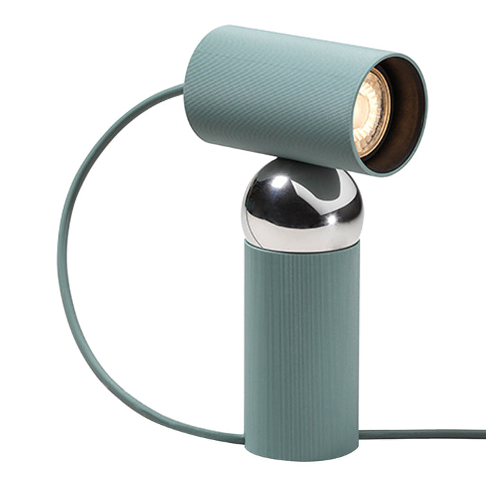 Modern blue-green lamp featuring a textured cylindrical base and shiny chrome accents for a sleek look.