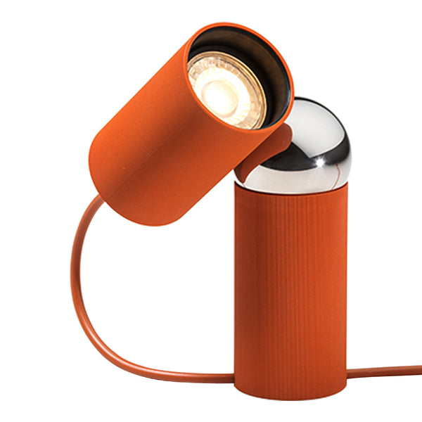 Stylish orange desk lamp with chrome accents and a sleek, modern design, featuring a textured cylindrical base.