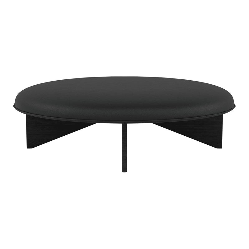 Round black coffee table with a smooth surface and minimalist design, featuring geometric black legs.