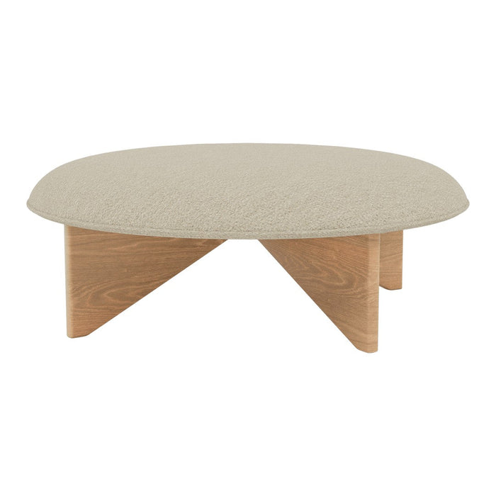 Round coffee table with a textured beige top and light wooden legs. Modern design with minimalist patterns.