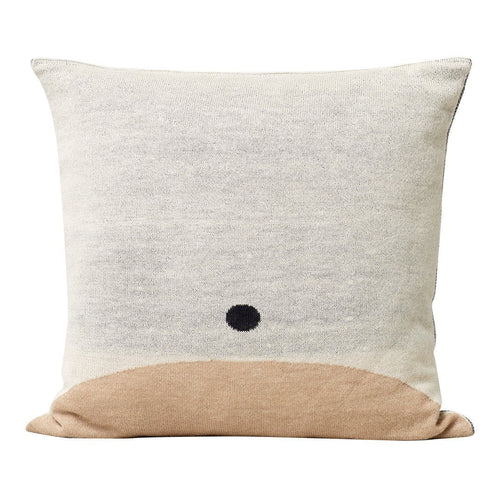 Cream and beige pillow featuring a minimalist black dot pattern on a textured surface. Perfect for modern decor.