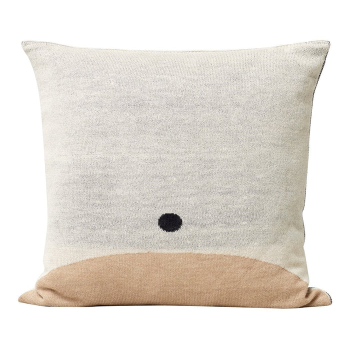 Cream and beige pillow featuring a minimalist black dot pattern on a textured surface. Perfect for modern decor.
