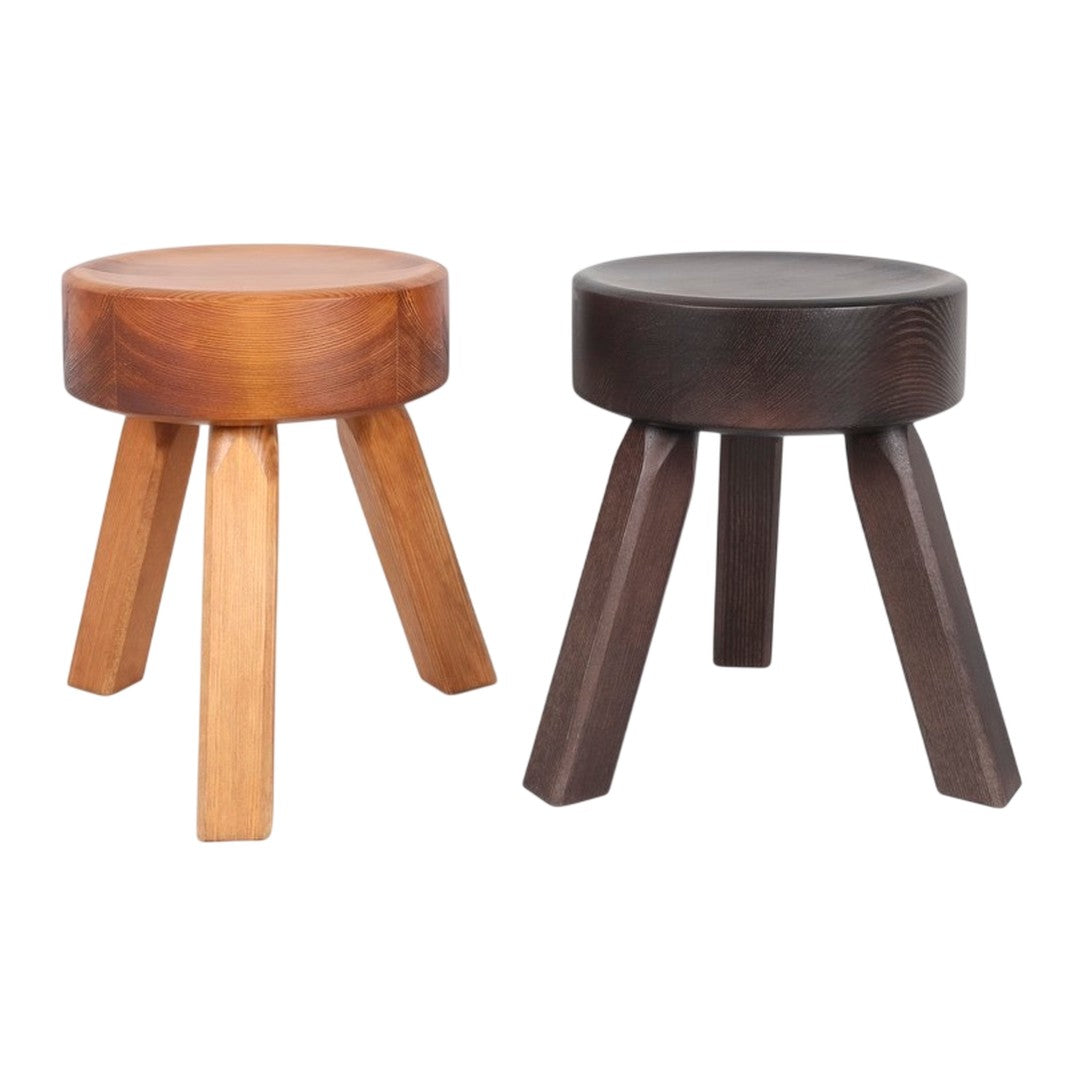 Two wooden stools in natural light brown and dark brown colors, featuring a smooth, round top and tapered legs.