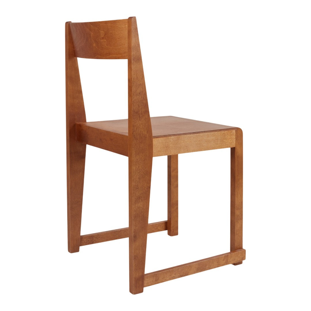 Natural wood chair in warm honey tones with a minimalist design and smooth finish. Perfect for modern decor.