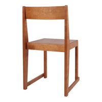 Solid wood chair in warm brown finish, featuring a minimalist design with clean lines and smooth surfaces.