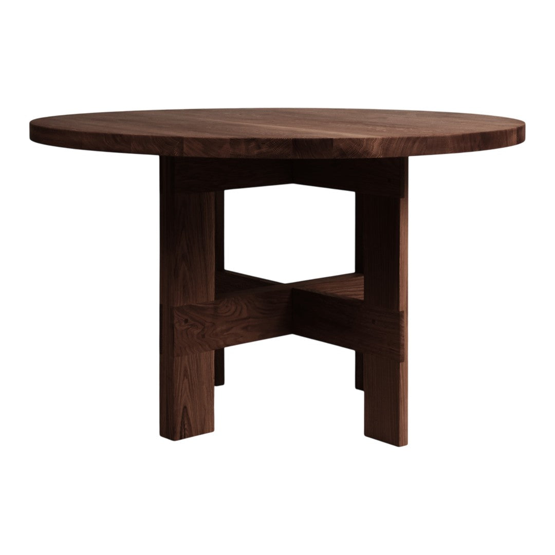Round dark wood table with a smooth finish and a minimalist cross-design base for modern aesthetic.