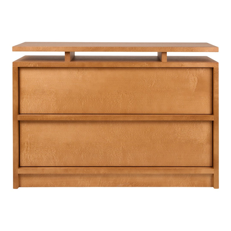 Modern light brown wood dresser with clean lines and minimalist design, featuring three spacious drawers and a flat top.