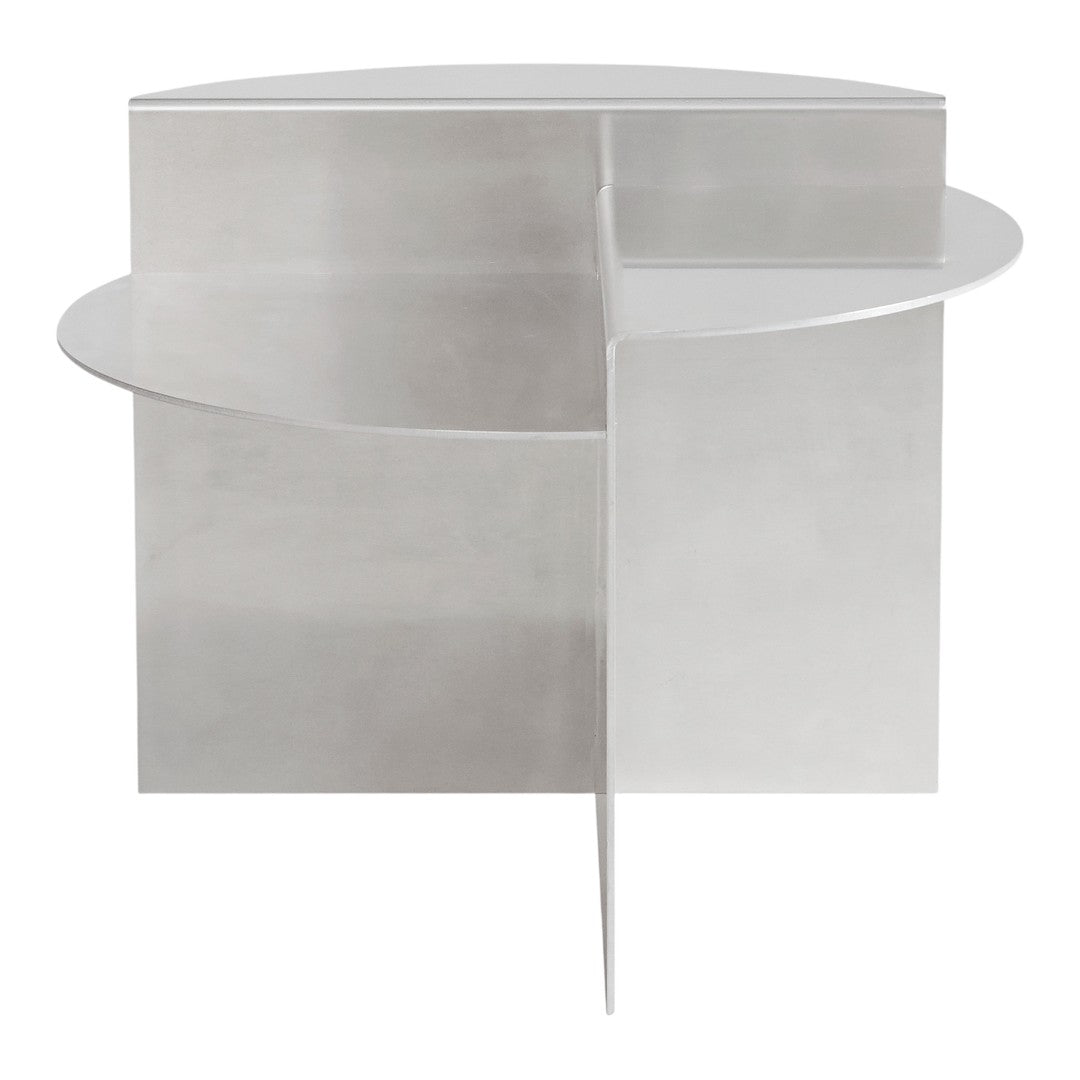 Sleek silver circular side table with a minimalist design and geometric shapes. Ideal for modern decor.